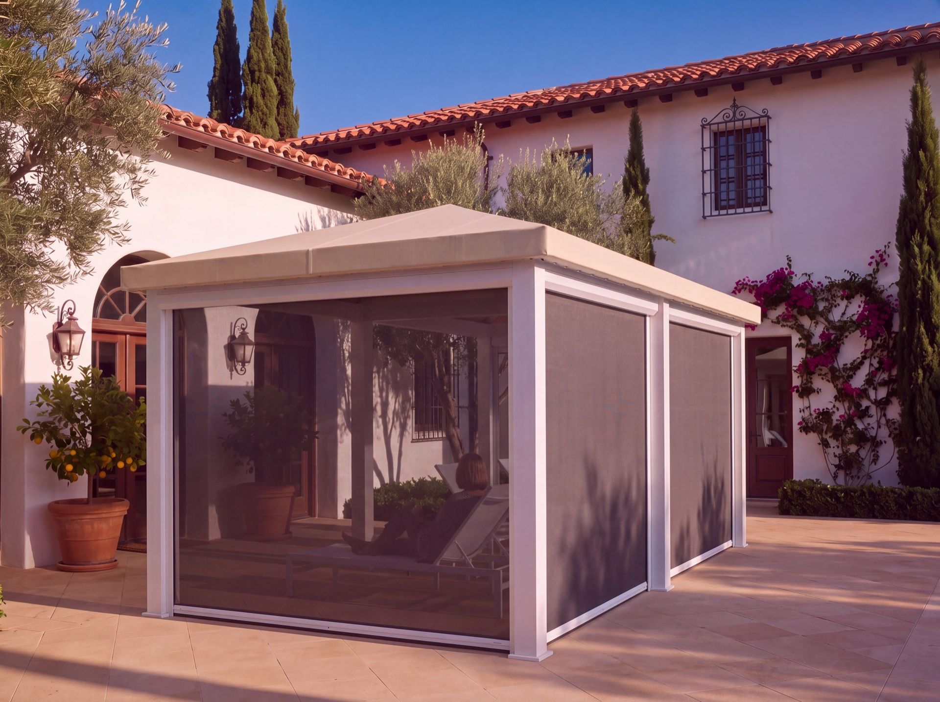 Drop screens lowered on a cabana over a terracotta patio