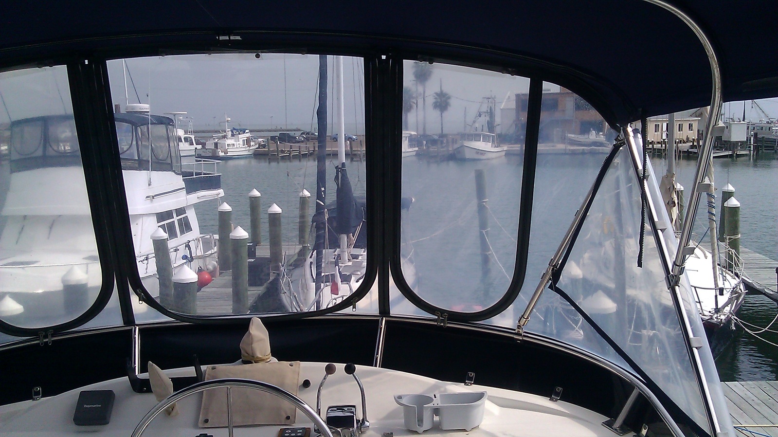 Clear vinyl enclosure installed aboard a boat