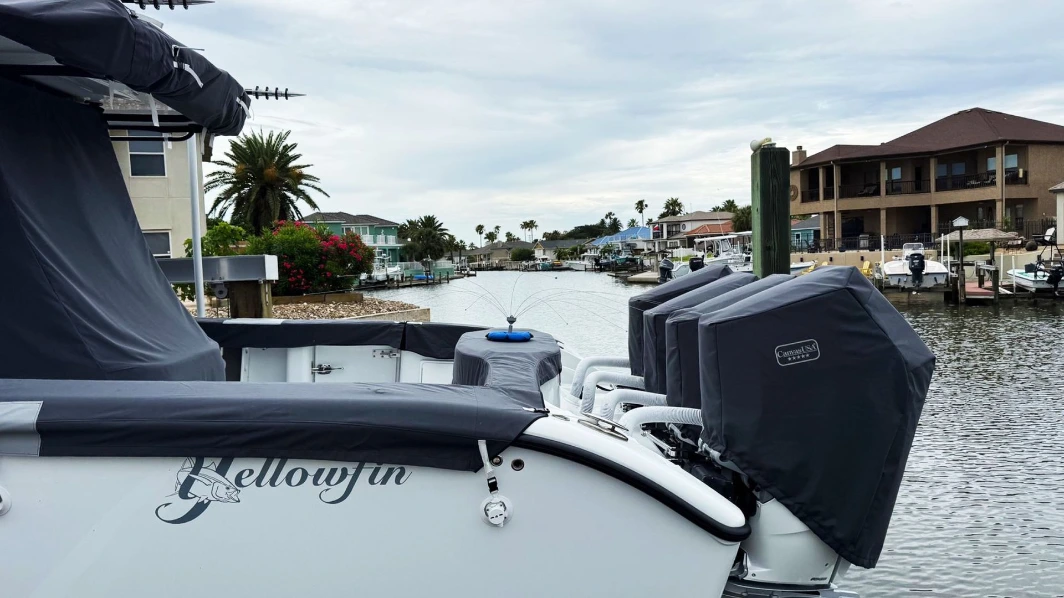 A Yellowfin with each of its outboards in a fitted charcoal Canvas USA® motor cover