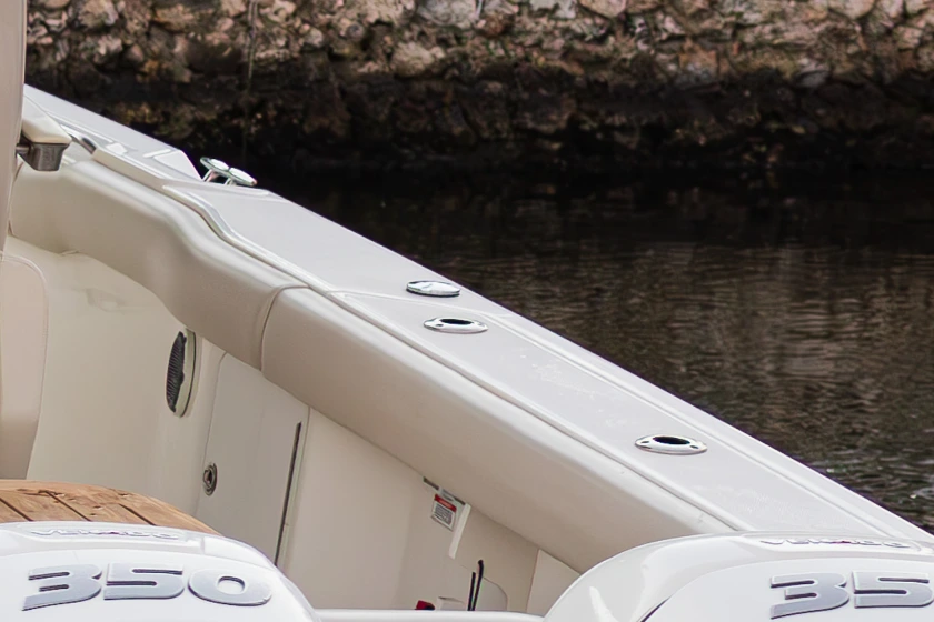 White Canvas USA® coaming pads along the cockpit of a center console