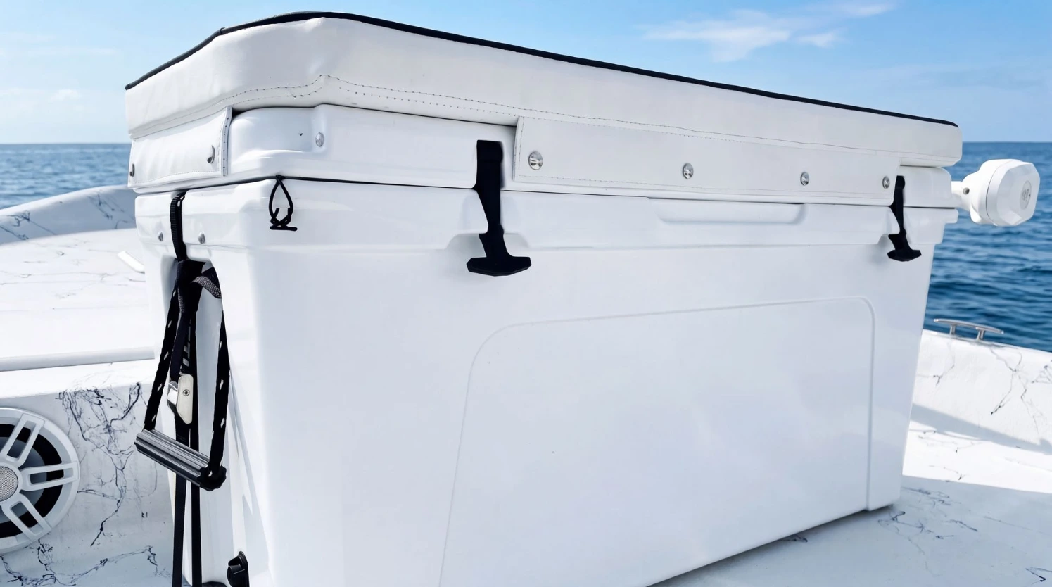 A white Canvas USA® cushion on a boat's ice chest
