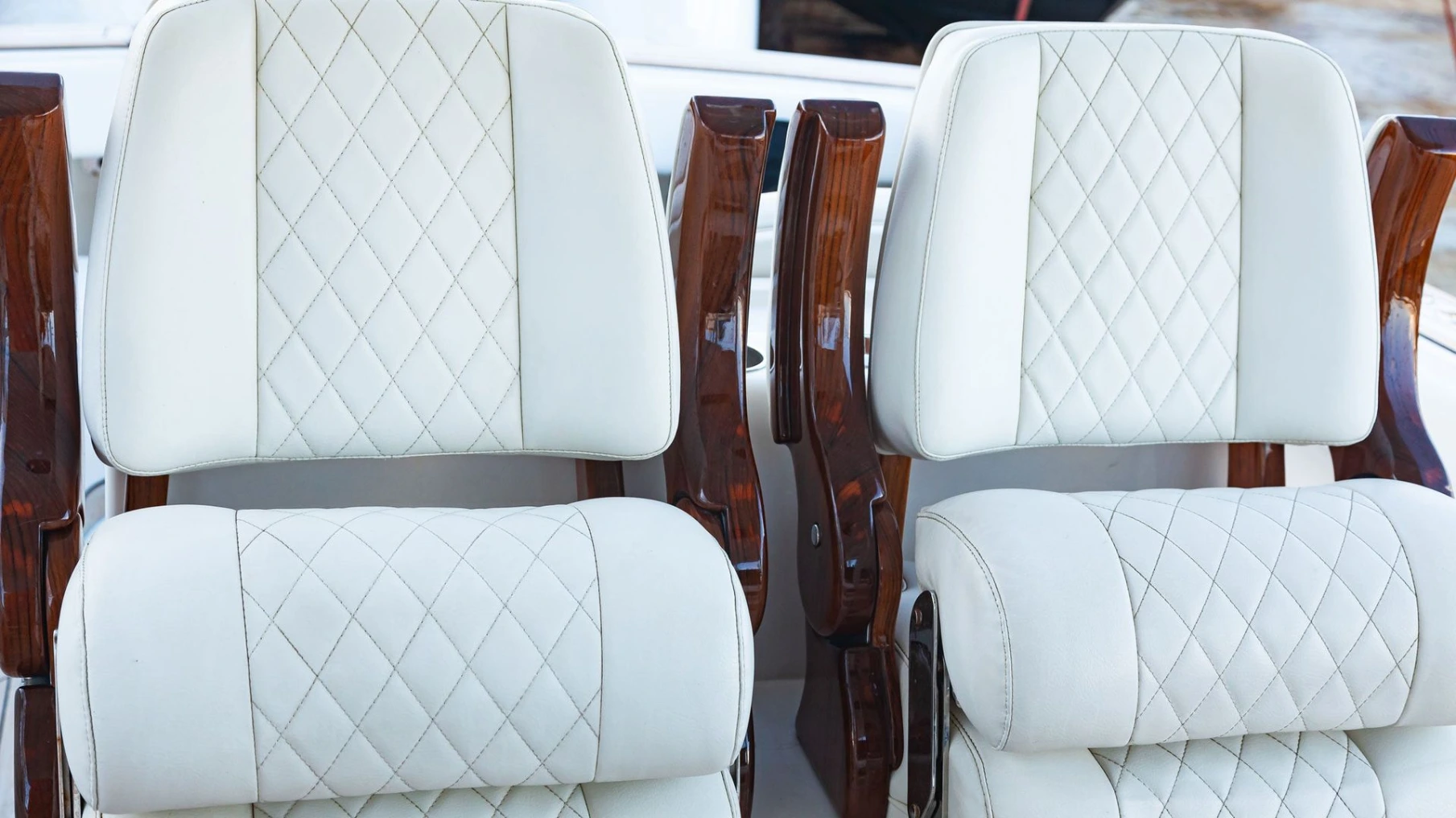 White diamond-stitched Canvas USA® captain's chairs