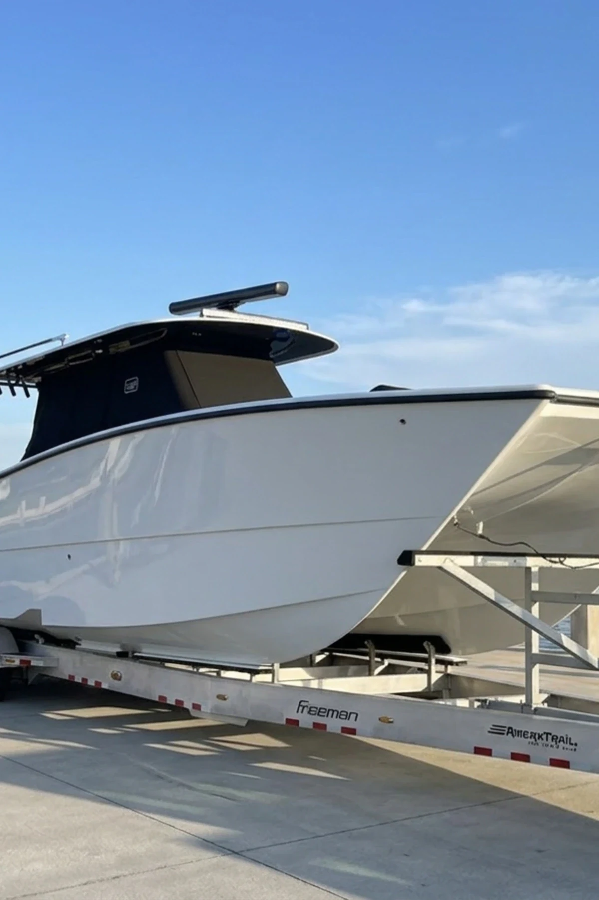 Center console on a trailer with a black T-top enclosure and console curtain
